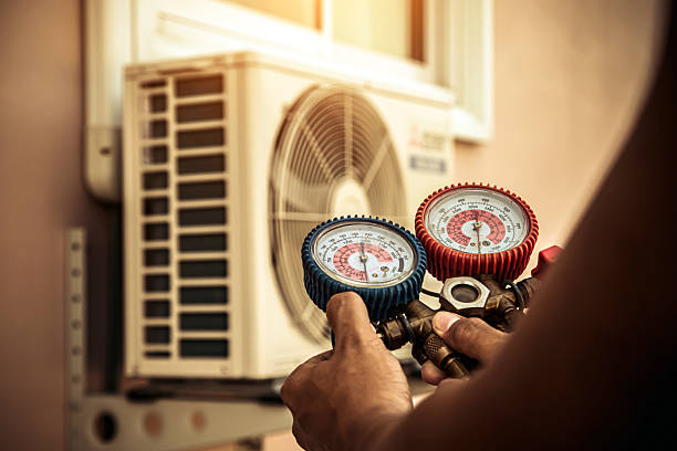 Professional Air Conditioning Service technician working in Polk City, IA